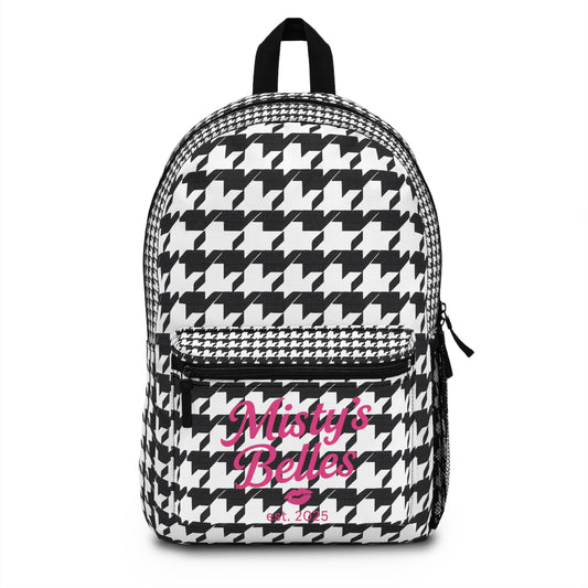 Stylish backpack featuring a houndstooth pattern and the text 'Misty's Belles' in pink.